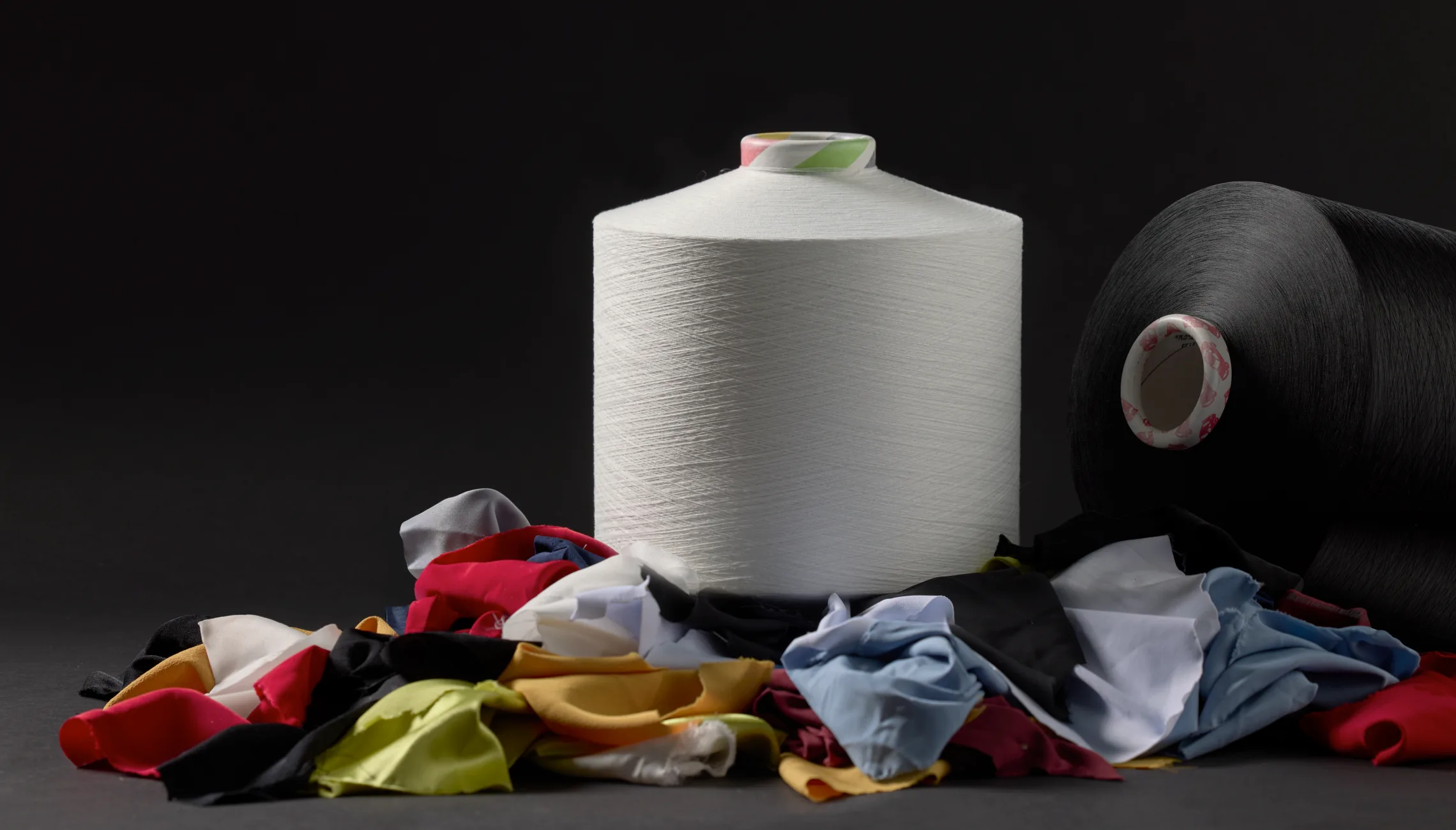 White spool black background feature image